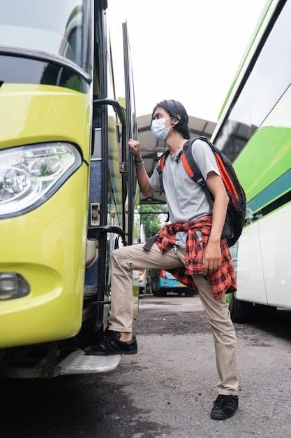 Man boarding a bus