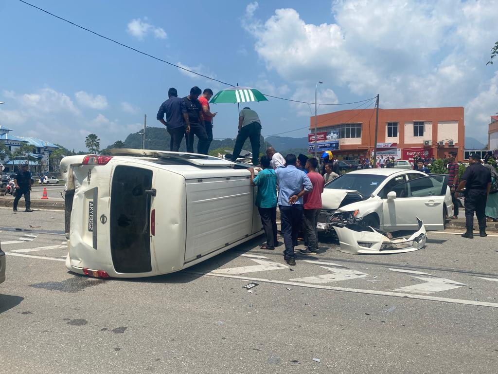 School van overturns after truck crashes into it in kelantan