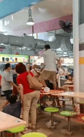 Fierce fight on the table breaks out between two elderly men over seating in Singapore.