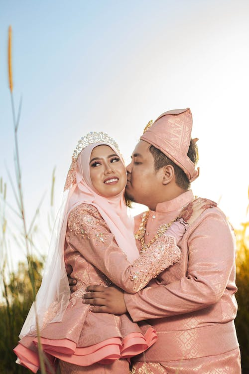 Malay married couple in their traditional wedding attire.