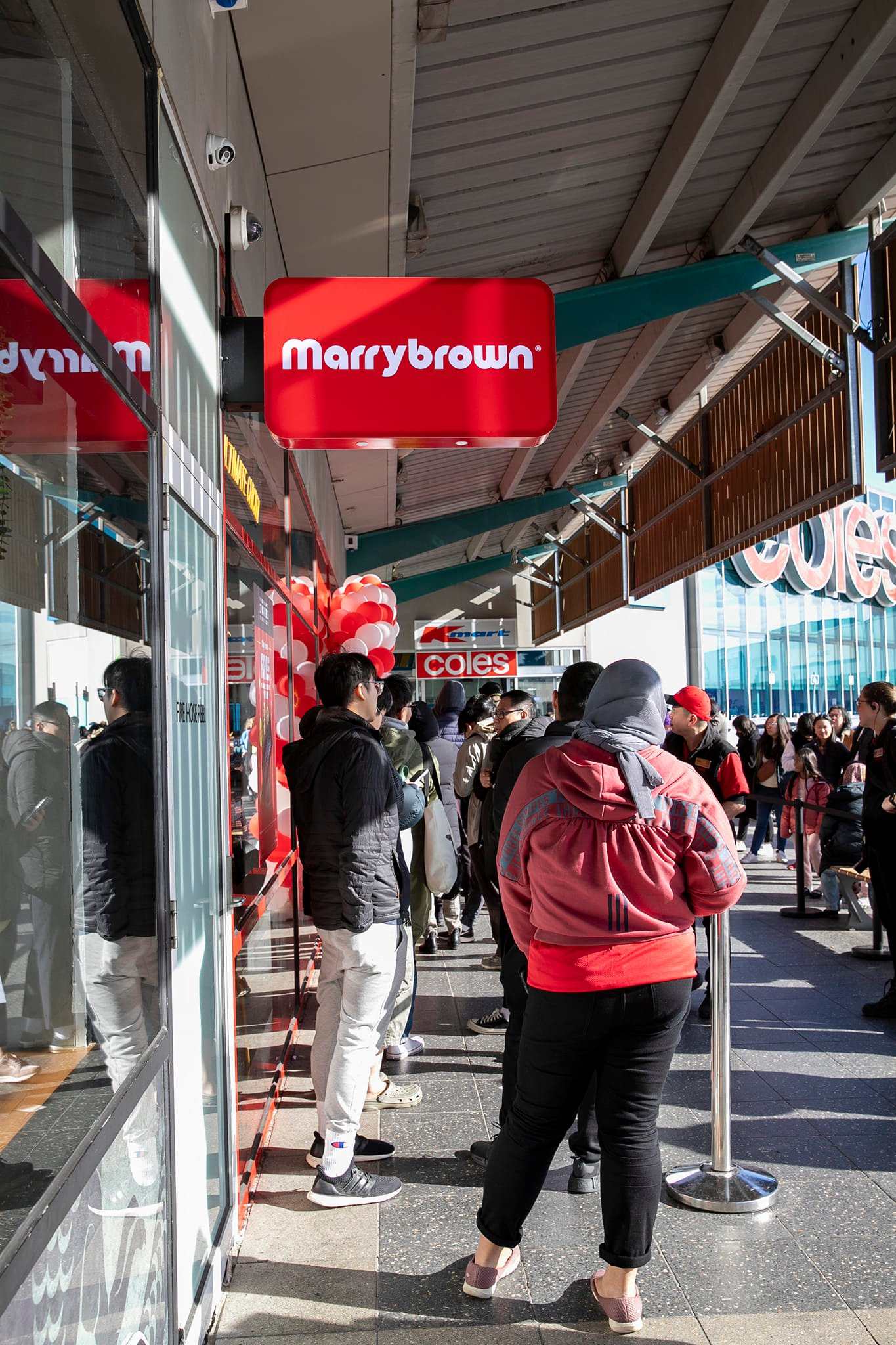 Many spotted lining up for hours to eat at m'sian chain marrybrown's first outlet in melbourne