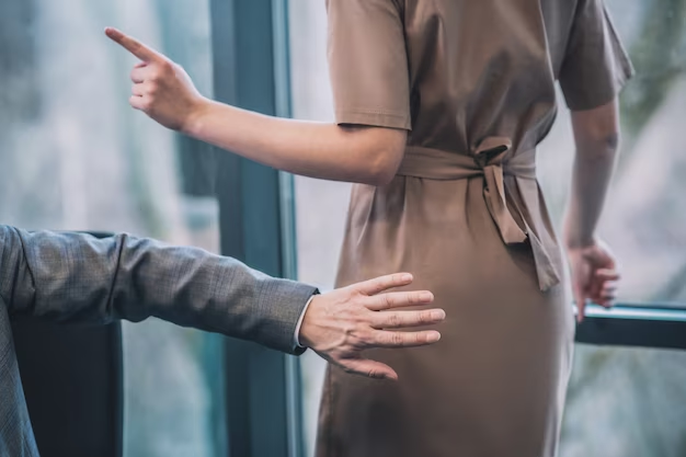 Man trying to touch a woman in sensitive areas