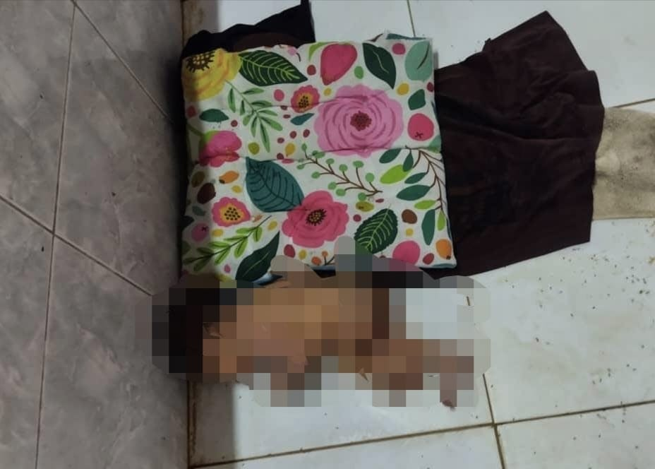 Newborn m'sian baby girl found abandoned at chicken shop with umbilical cord attached