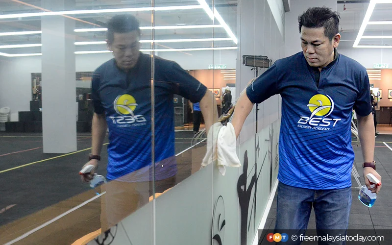 Former m'sian squash champion now works as cleaner at kl archery centre