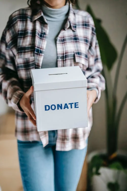 Woman holding a donation box