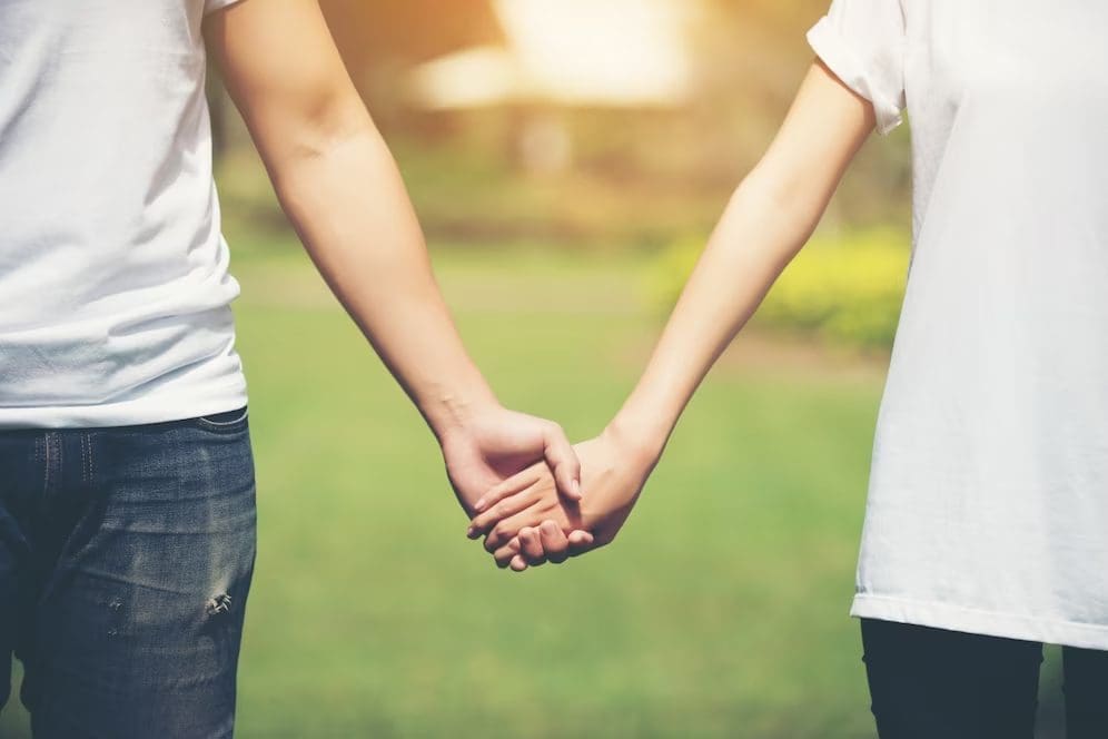 Couple holding hands