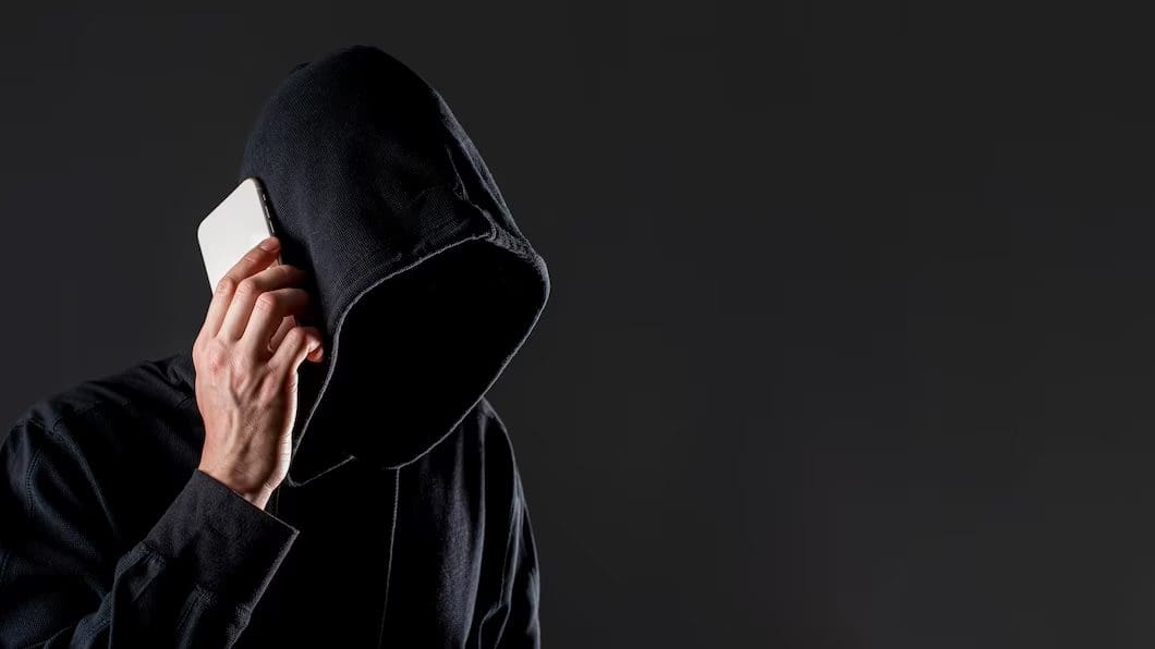 scammer in a hoodie