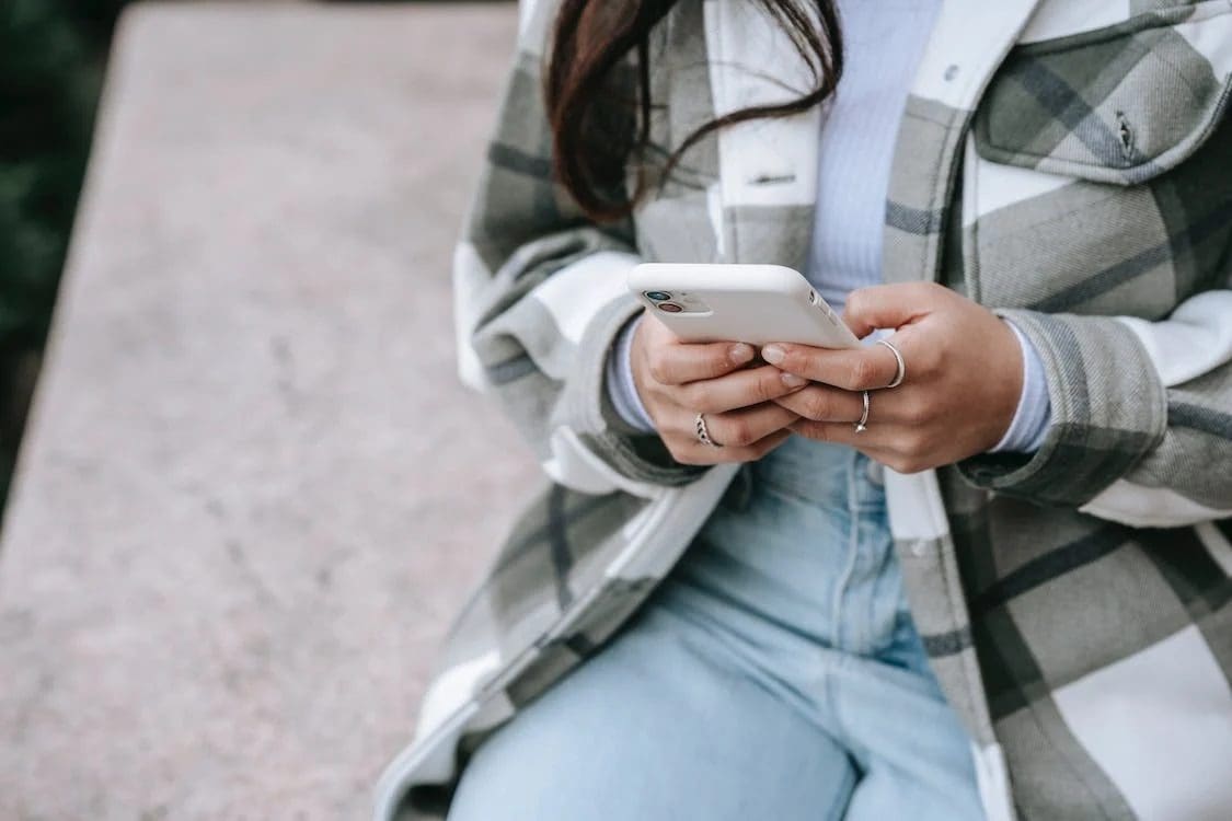 Woman with mobile phone in her hand