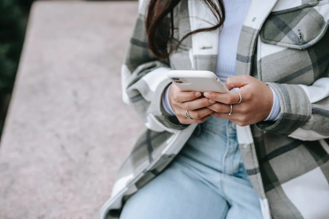 Woman with mobile phone in her hand