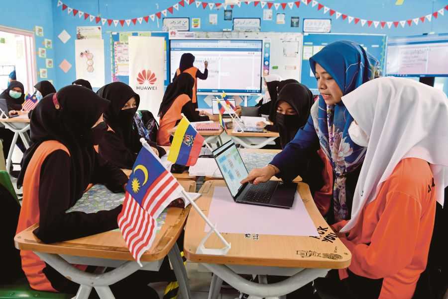 Malaysian teacher in a classroom with students
