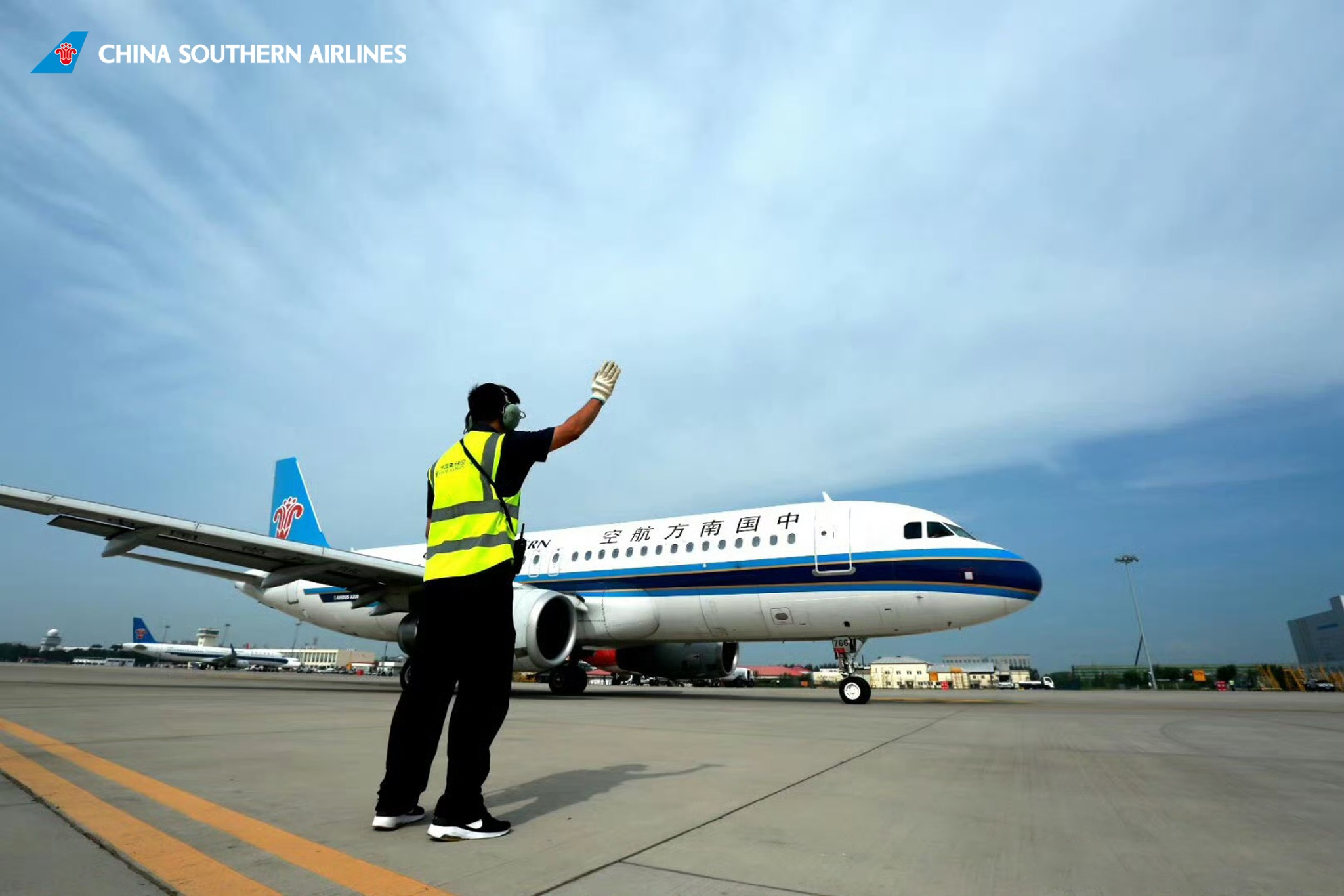 China southern airlines staff guiding plane