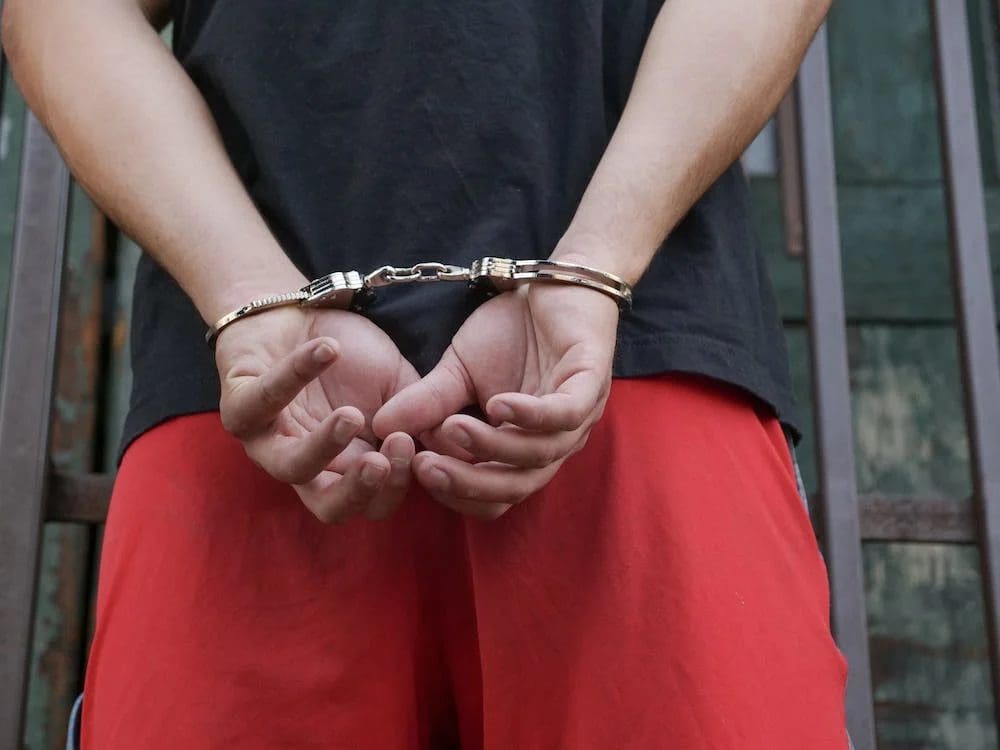 Person in handcuffs