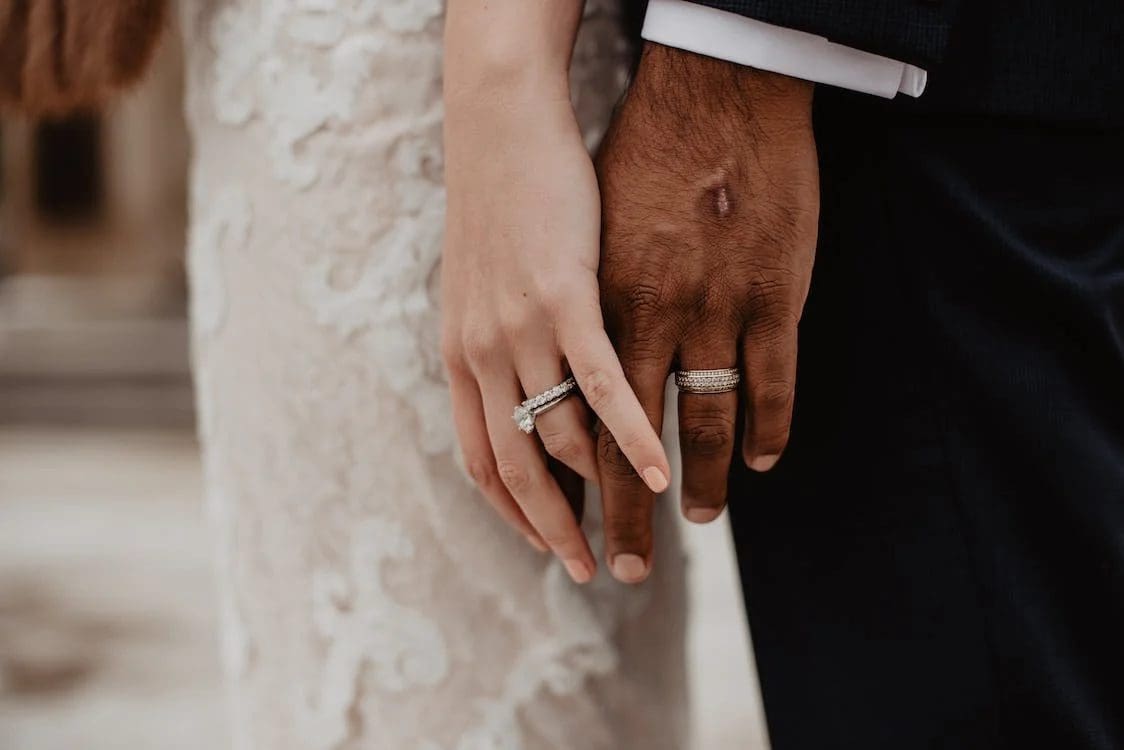 Married couple holding hands