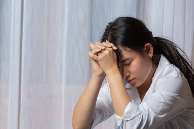 Sad young Asian woman
