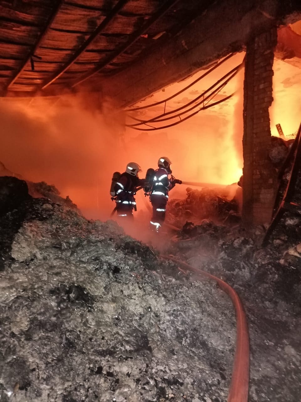 Firefighters work to put out fire at Aik Cheong warehouse in Melaka