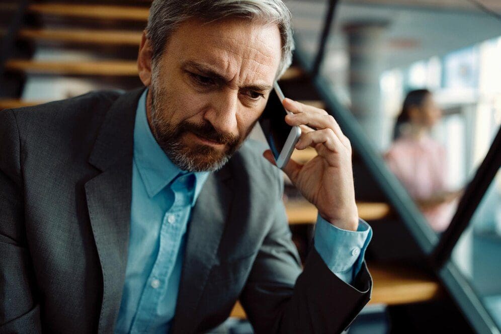 Displeased man making a phone call
