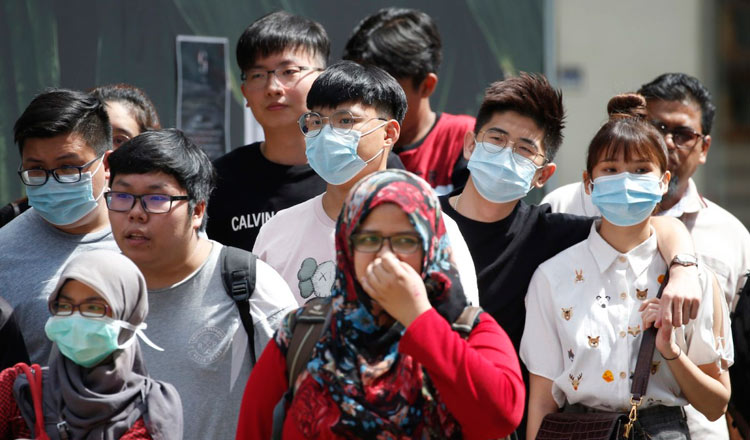 Malaysians wearing face masks