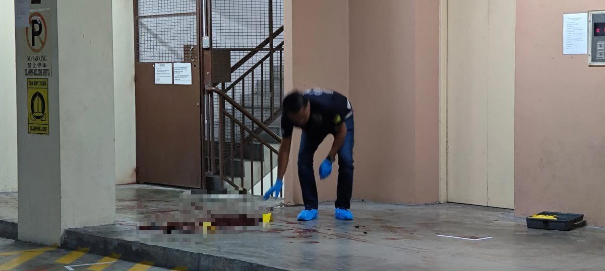 Police investigating crime scene at apartment in Penang