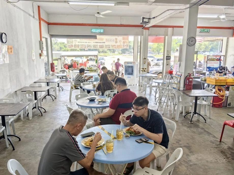 Customers eating at chap fan restaurant in Sungai Petani