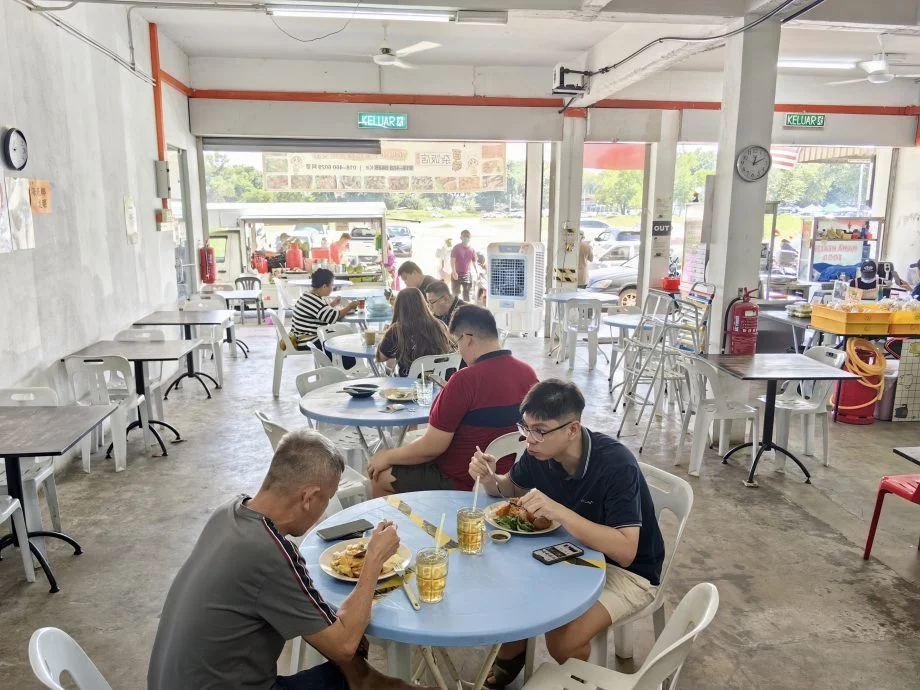 Customers eating at chap fan restaurant in sungai petani