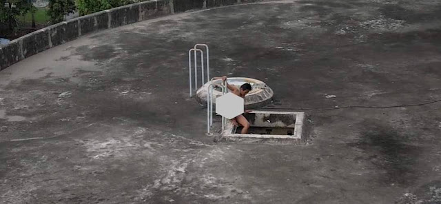 39yo m'sian woman climbs into water tank naked