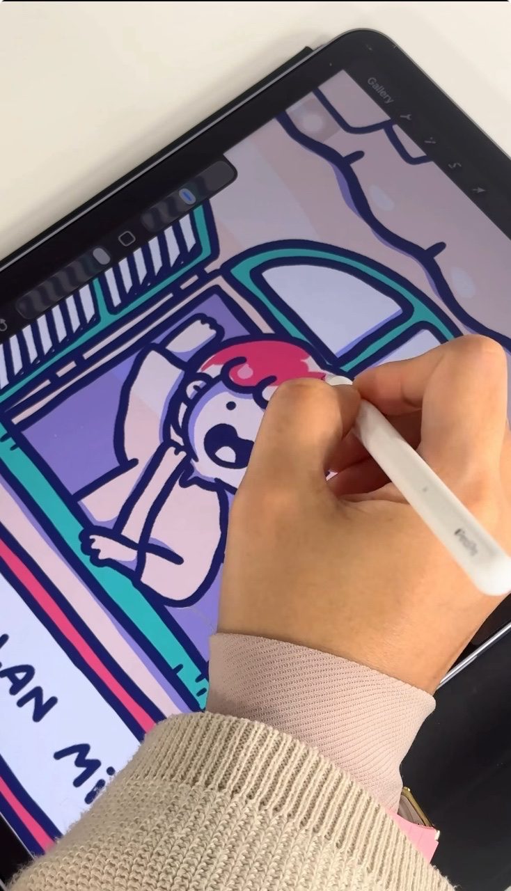 Eqa drawing on her ipad