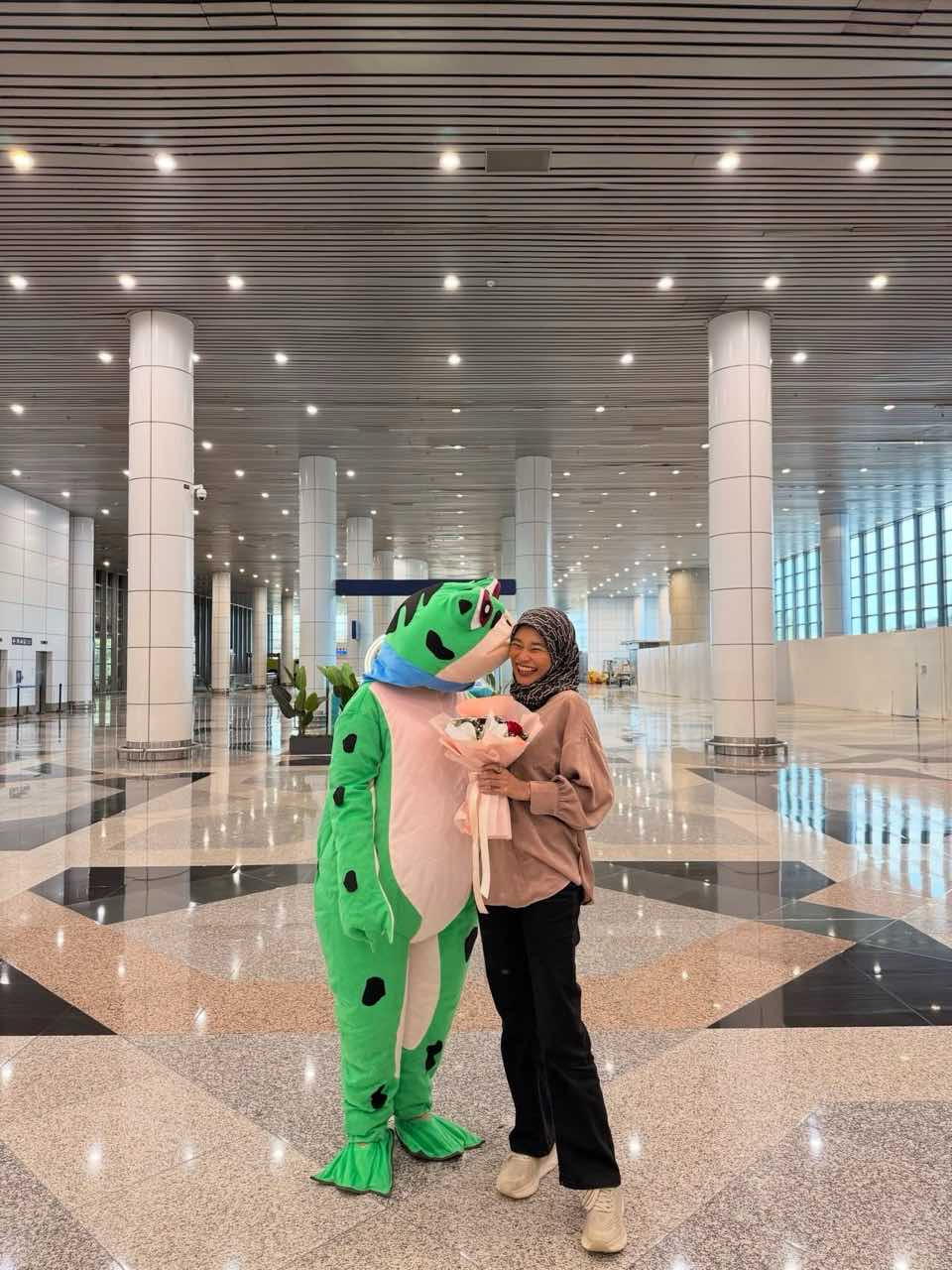 Amira with her husband as a frog