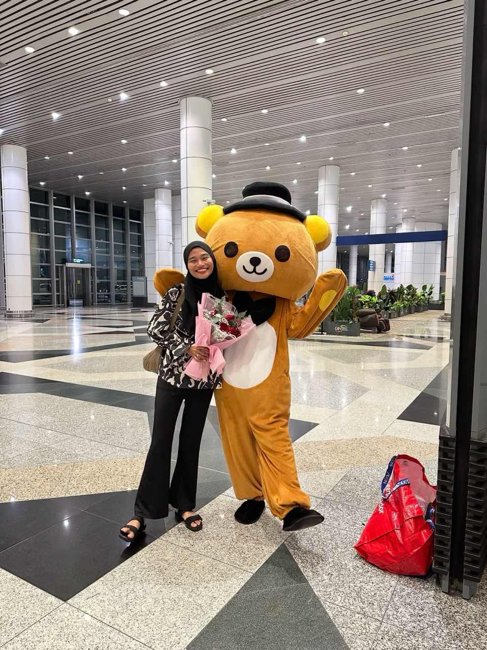 Amira with her husband as a bear 