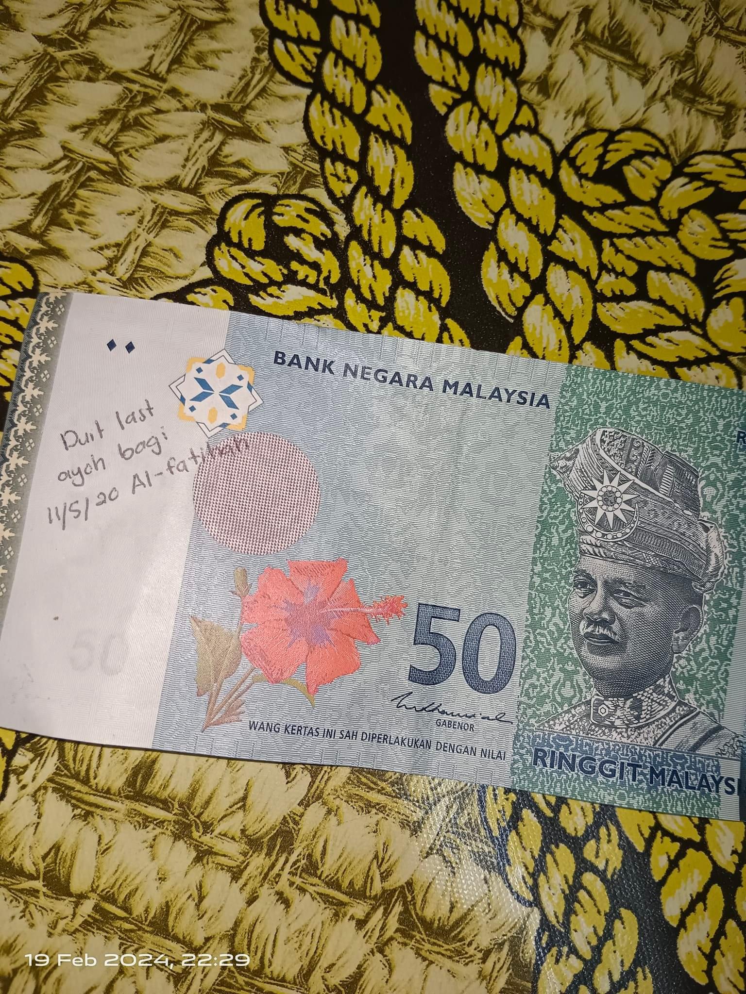 Rm50 ringgit scribbled with heartfelt text: 