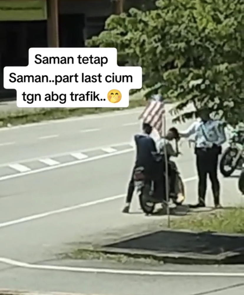 M'sian teen kisses traffic police's hand despite getting fined