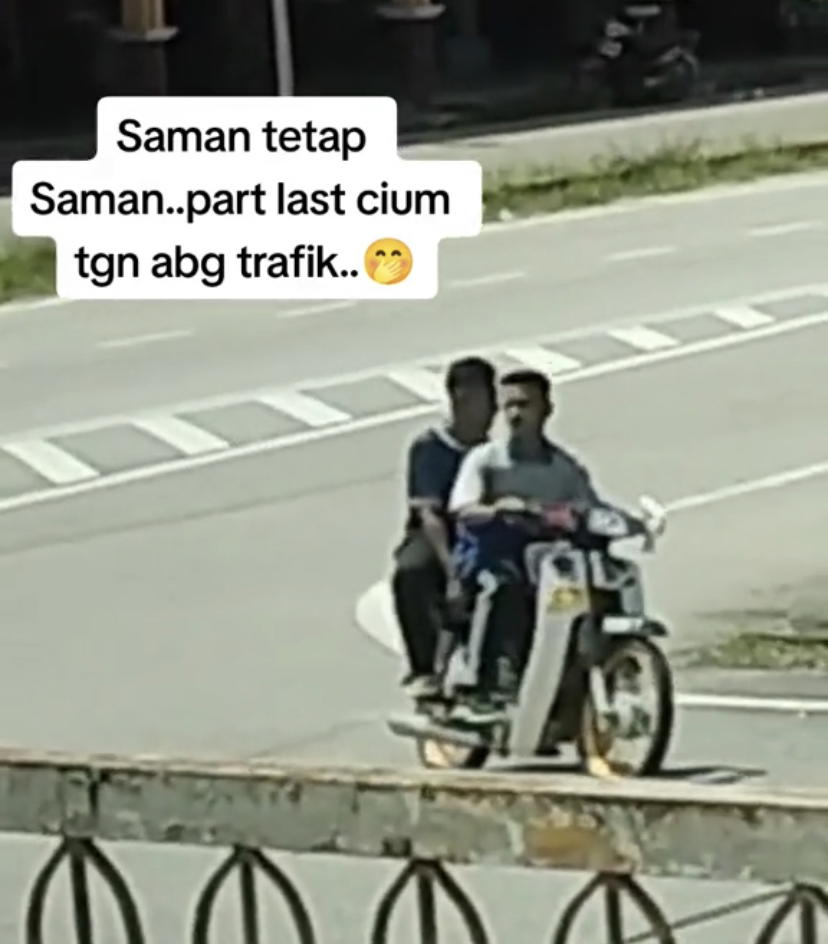 2 malaysian teens riding a motorcycle without helmets