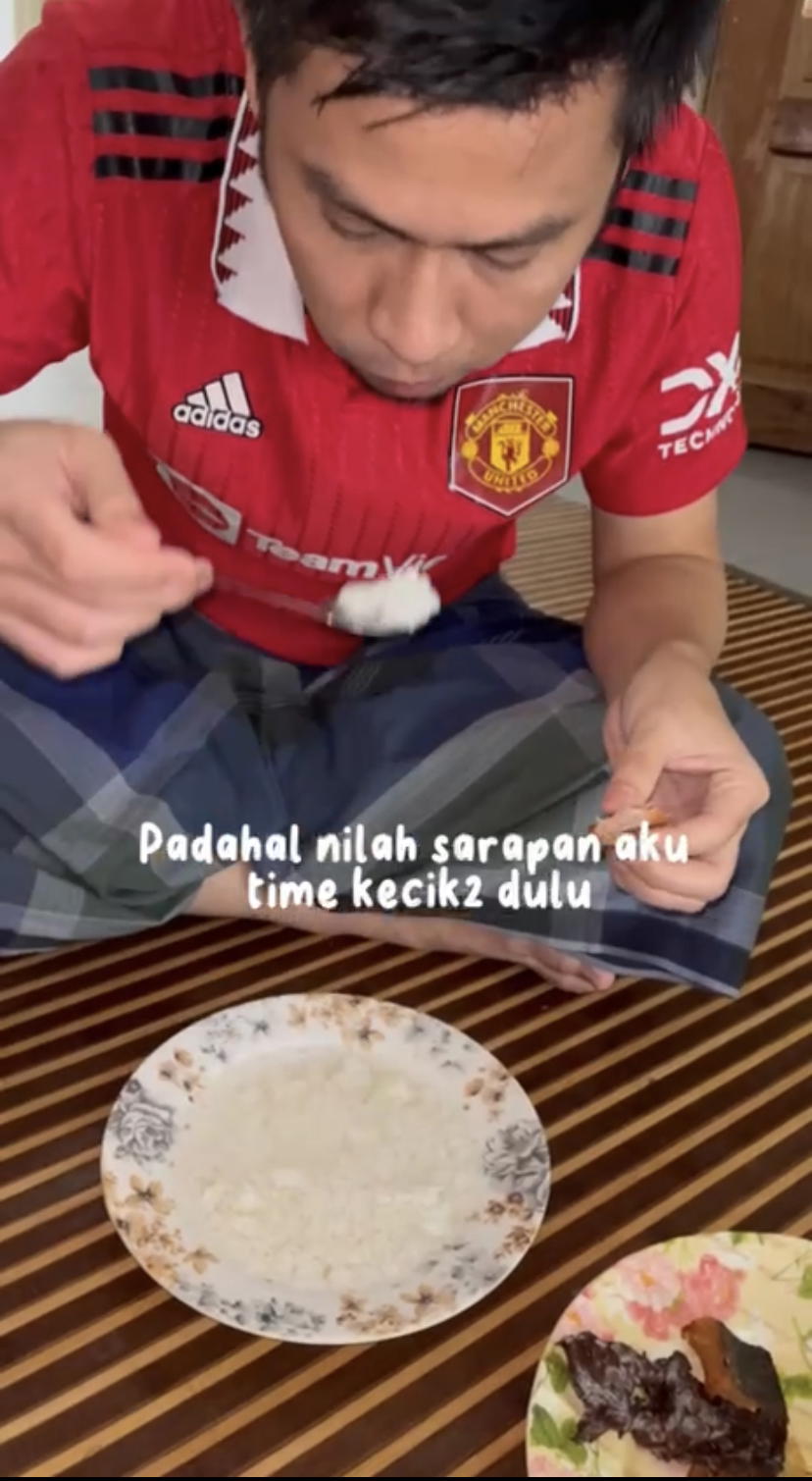 Man eats plain rice with mineral water