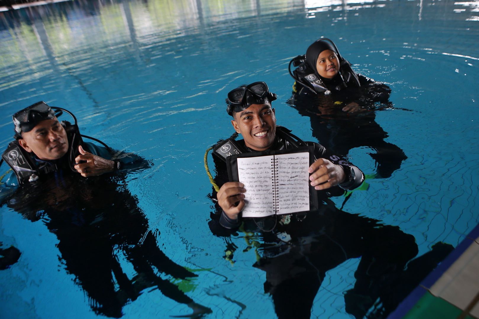 Ahmad fudhail ahmad kenedi showing essay he wrote while underwater