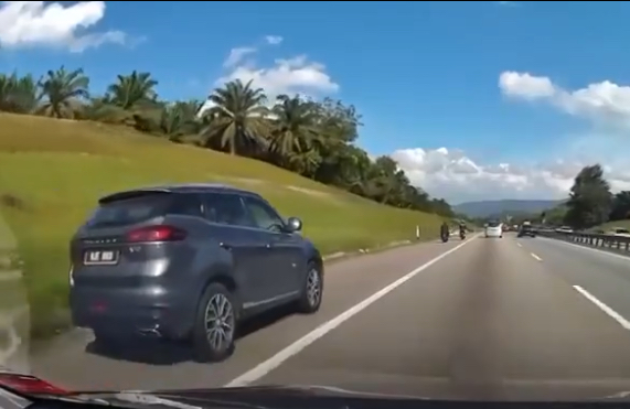 Proton x70 driver uses emergency lane & gets called out by motorcyclist - literally