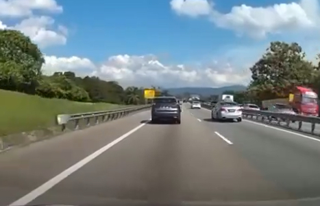 Proton x70 driver uses emergency lane & gets called out by motorcyclist - literally