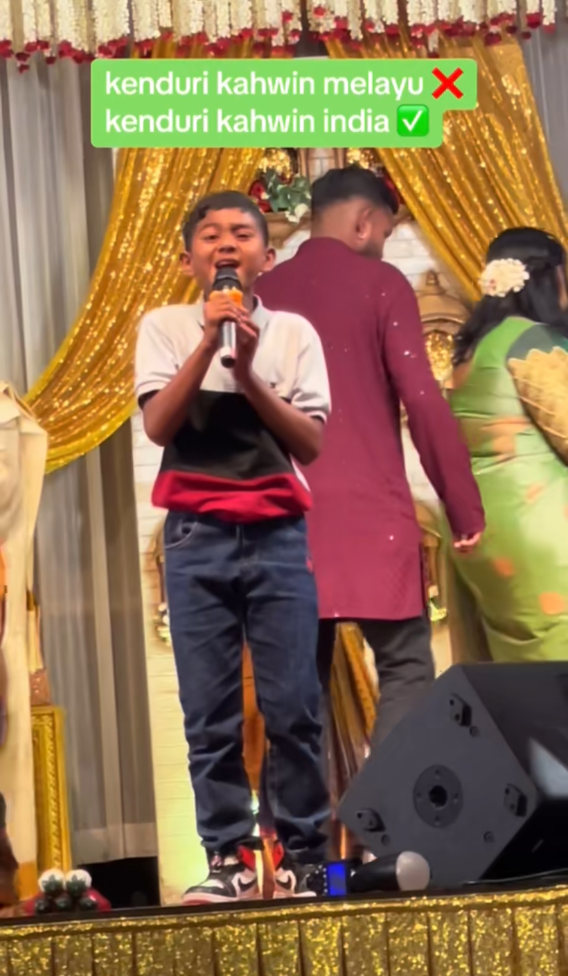 Malaysian indian boy singing classic malay song at indian wedding