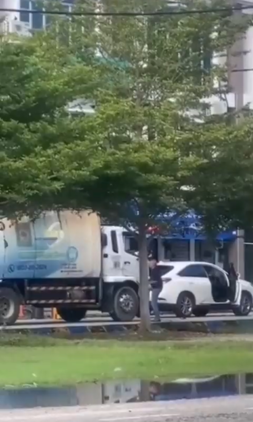 Man arguing with garbage truck driver