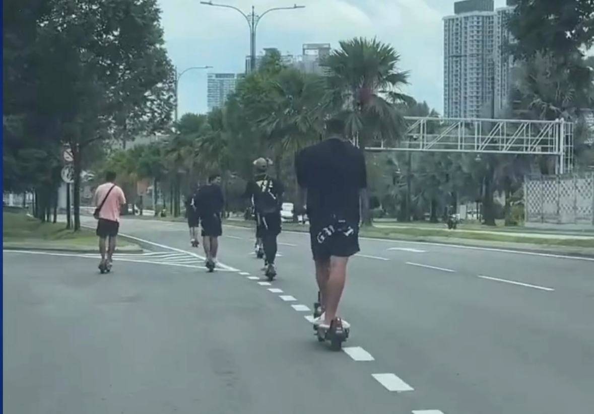 8 men recklessly ride e-scooters and occupy car lanes along kl road