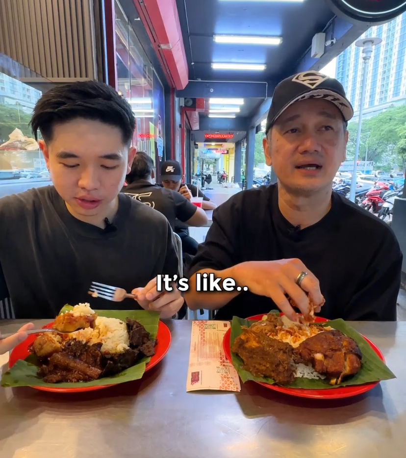 Pua chu kang eats nasi lemak with his hand