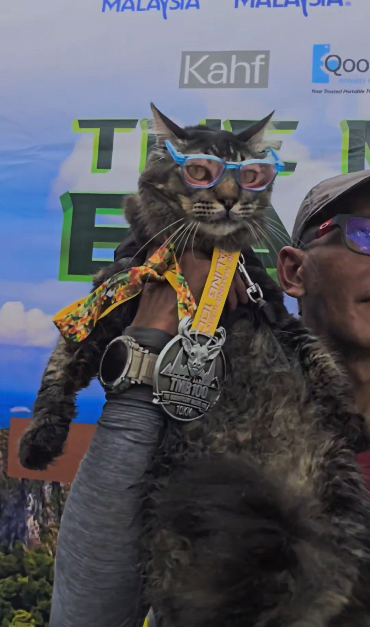 Forget running solo, m'sian man completes 10km trail race with his cat riding on his shoulder