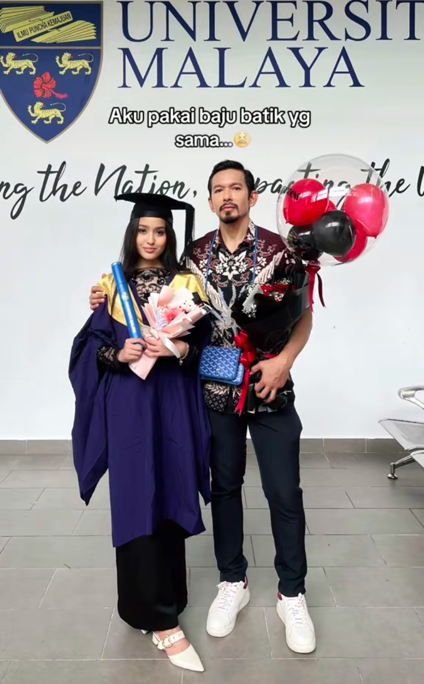 Father with his graduated daughter at university malaya