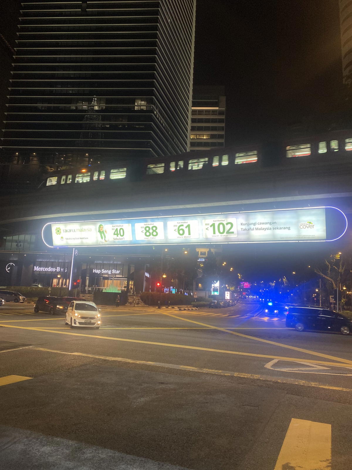 Monorail bukit nines at nigh time.