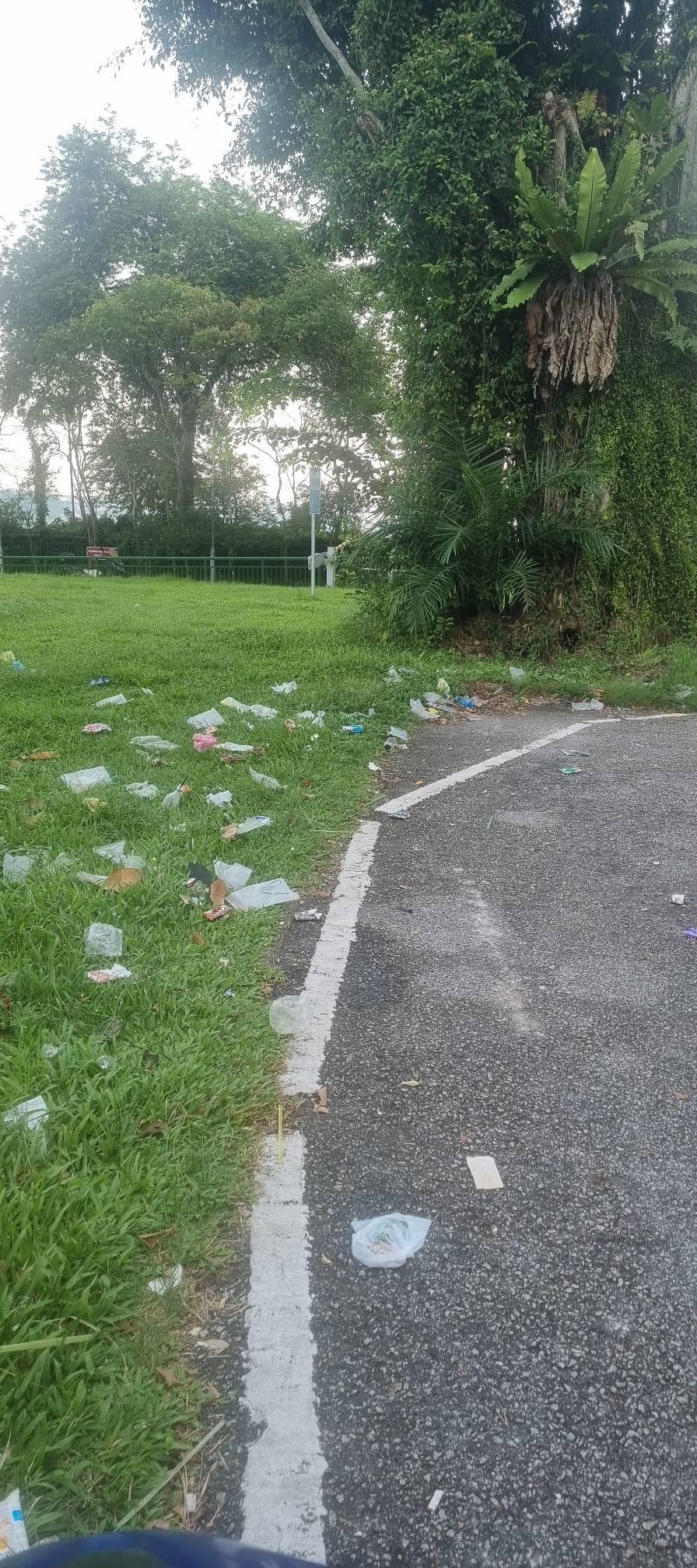 Motorcyclist at littered spot in singapore