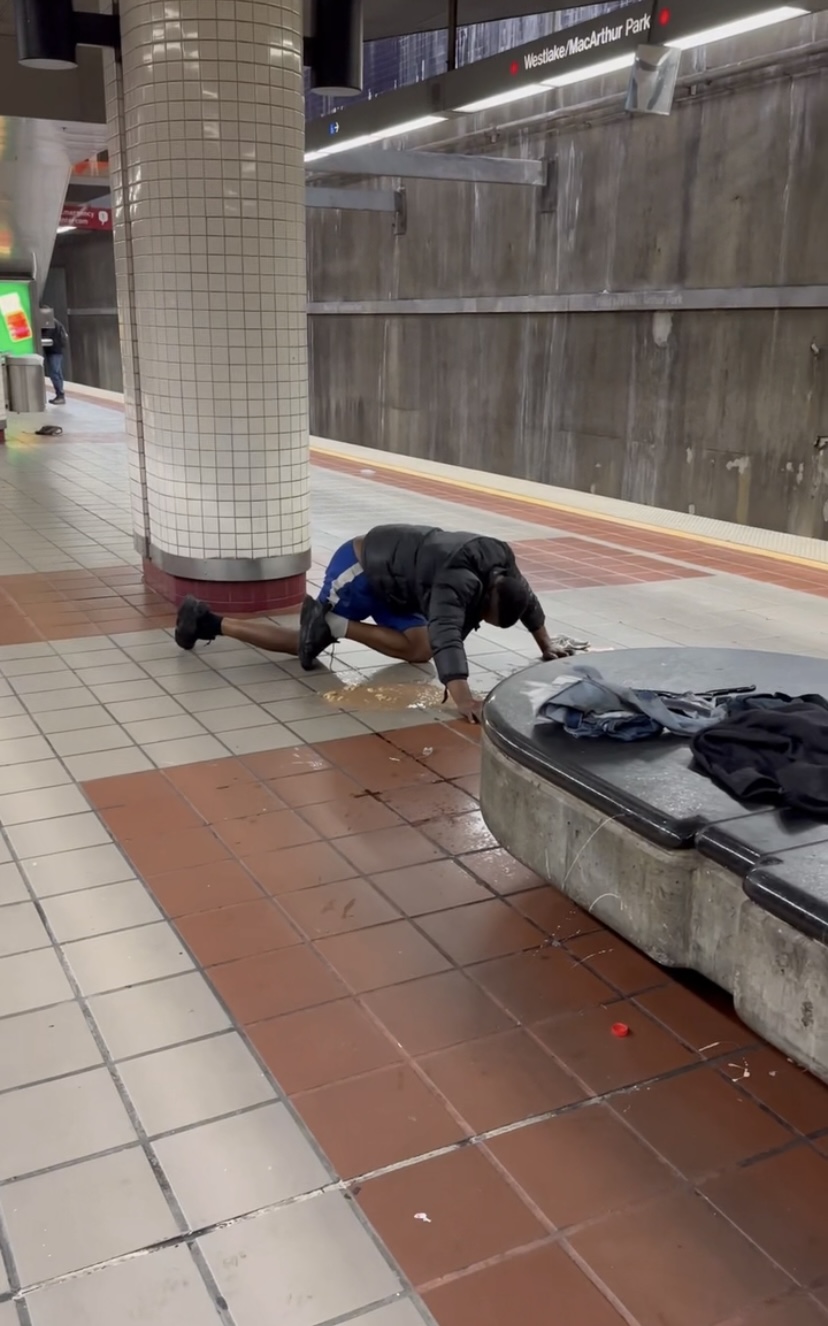 Man vomitting on the floor at la metro station