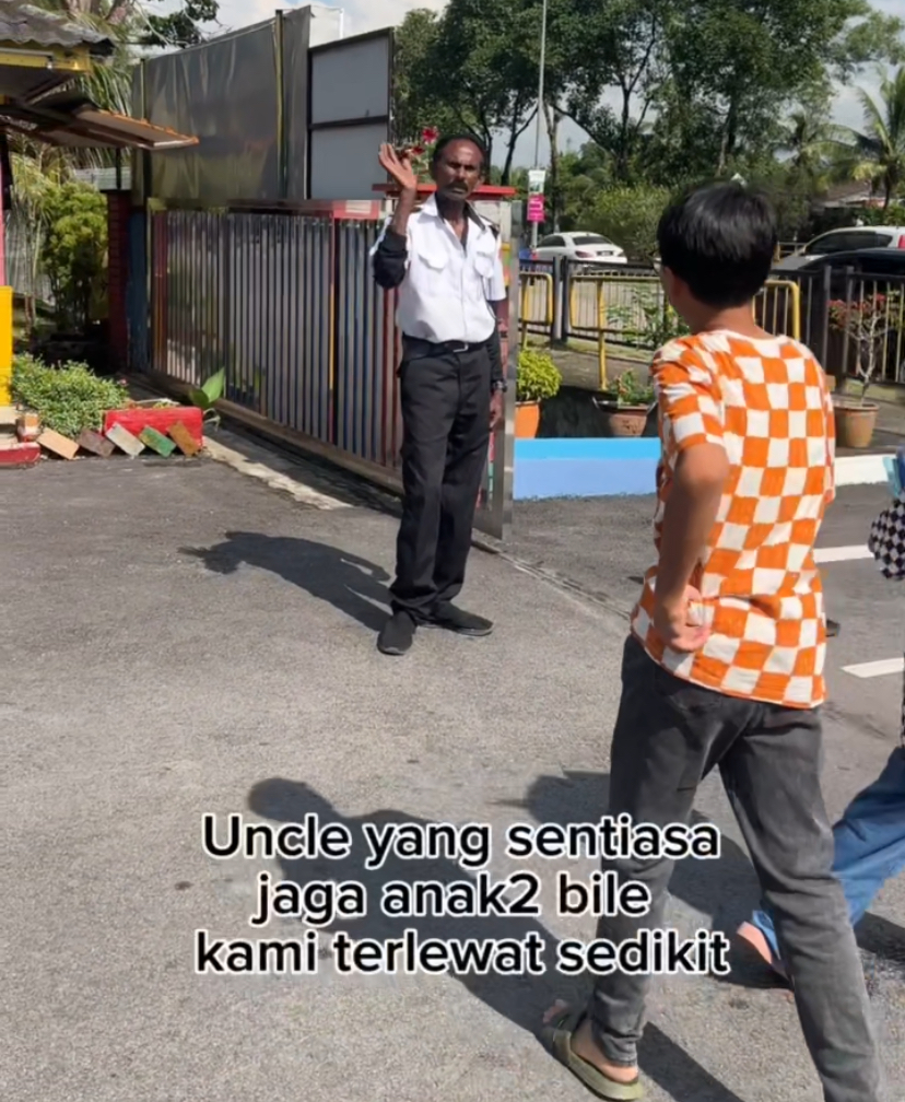 M'sian boy hugs school security guard