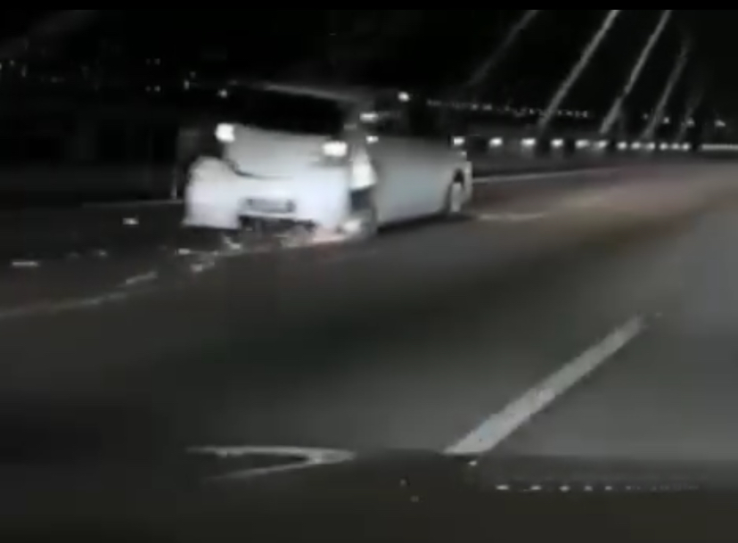 Axia with severe dents and missing rear tire on penang bridge