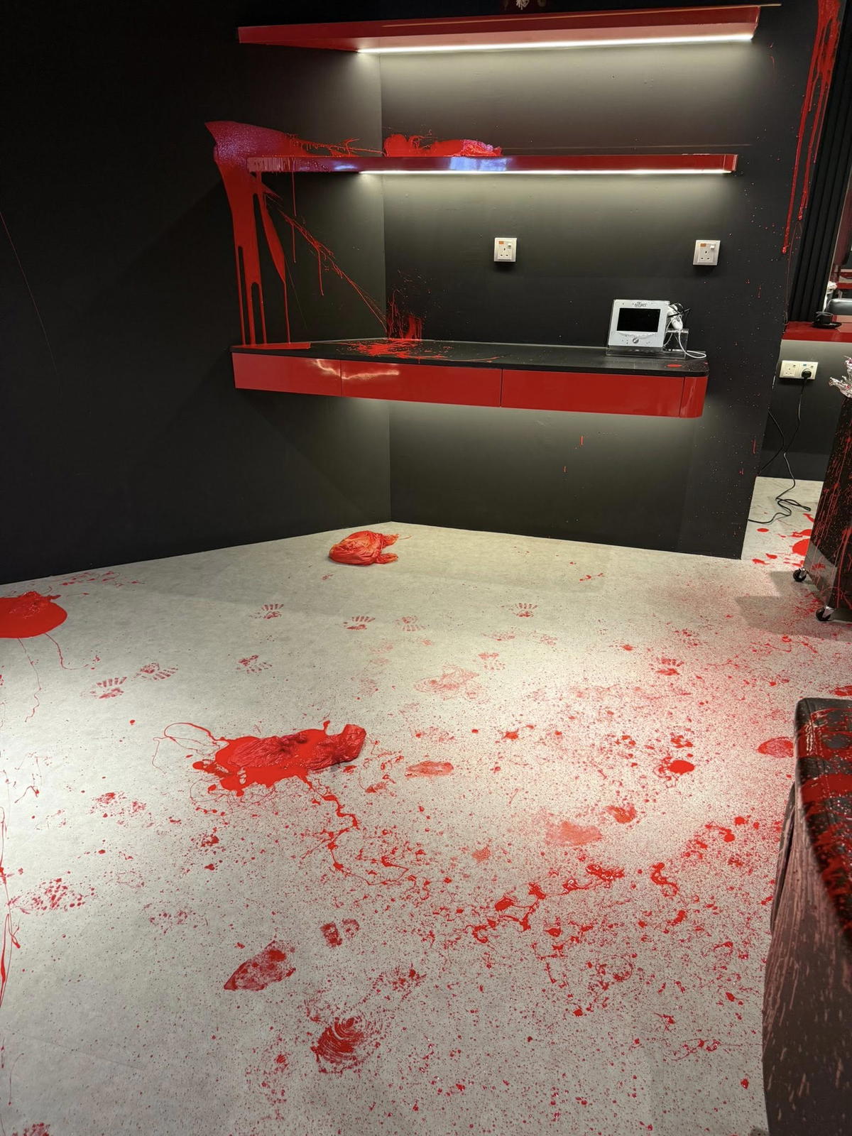 JB salon covered in red paint