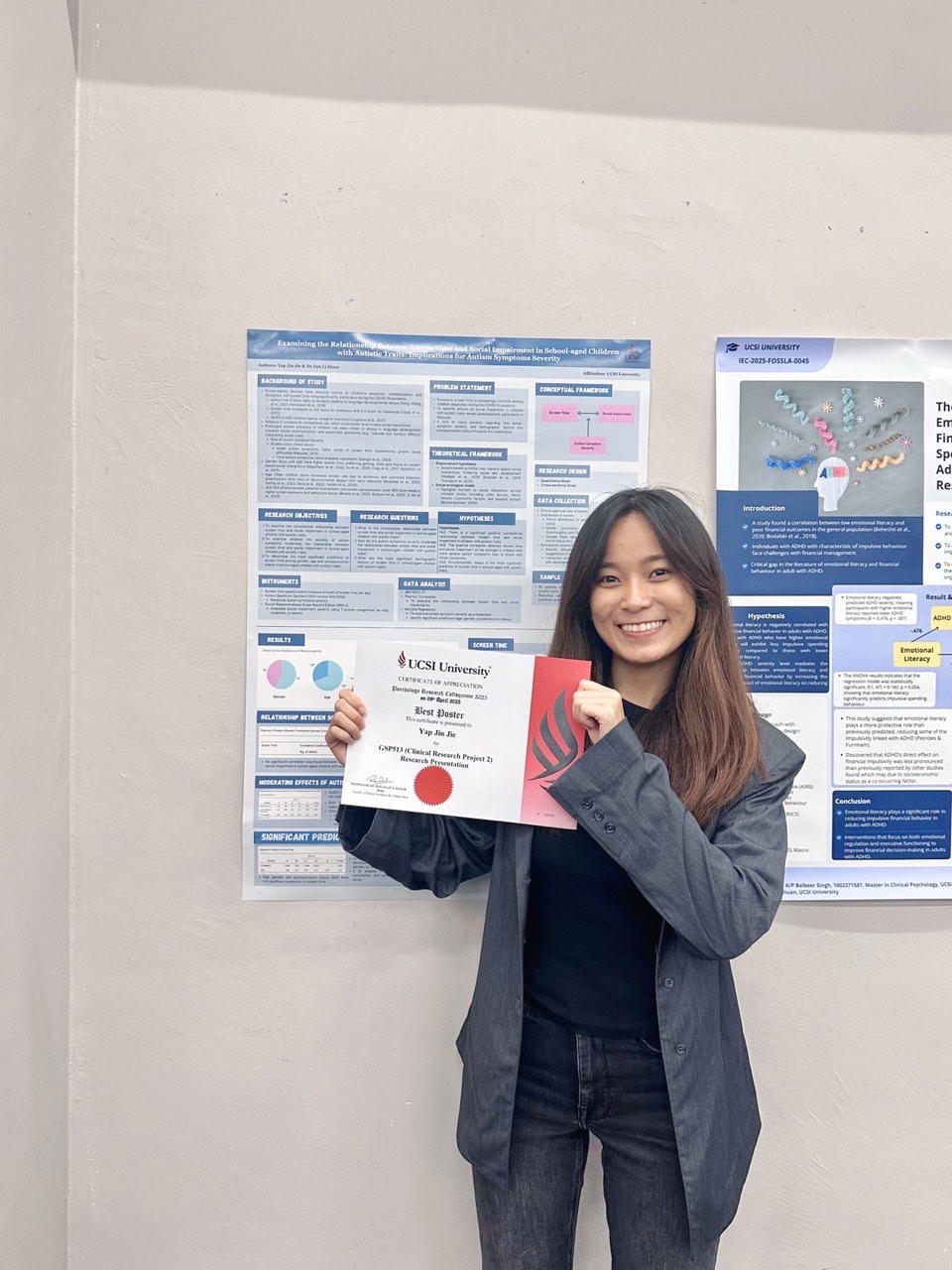 JJ holding her certificate