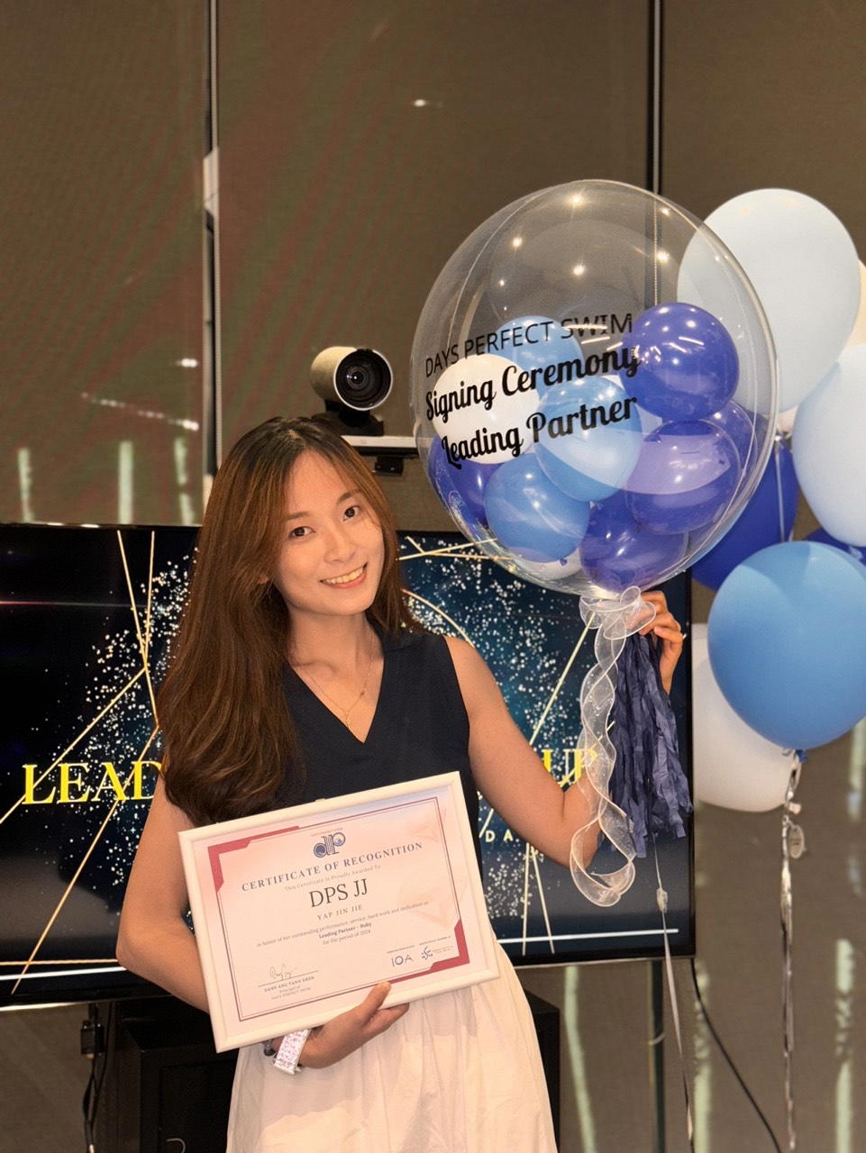 JJ with her swimming certificate