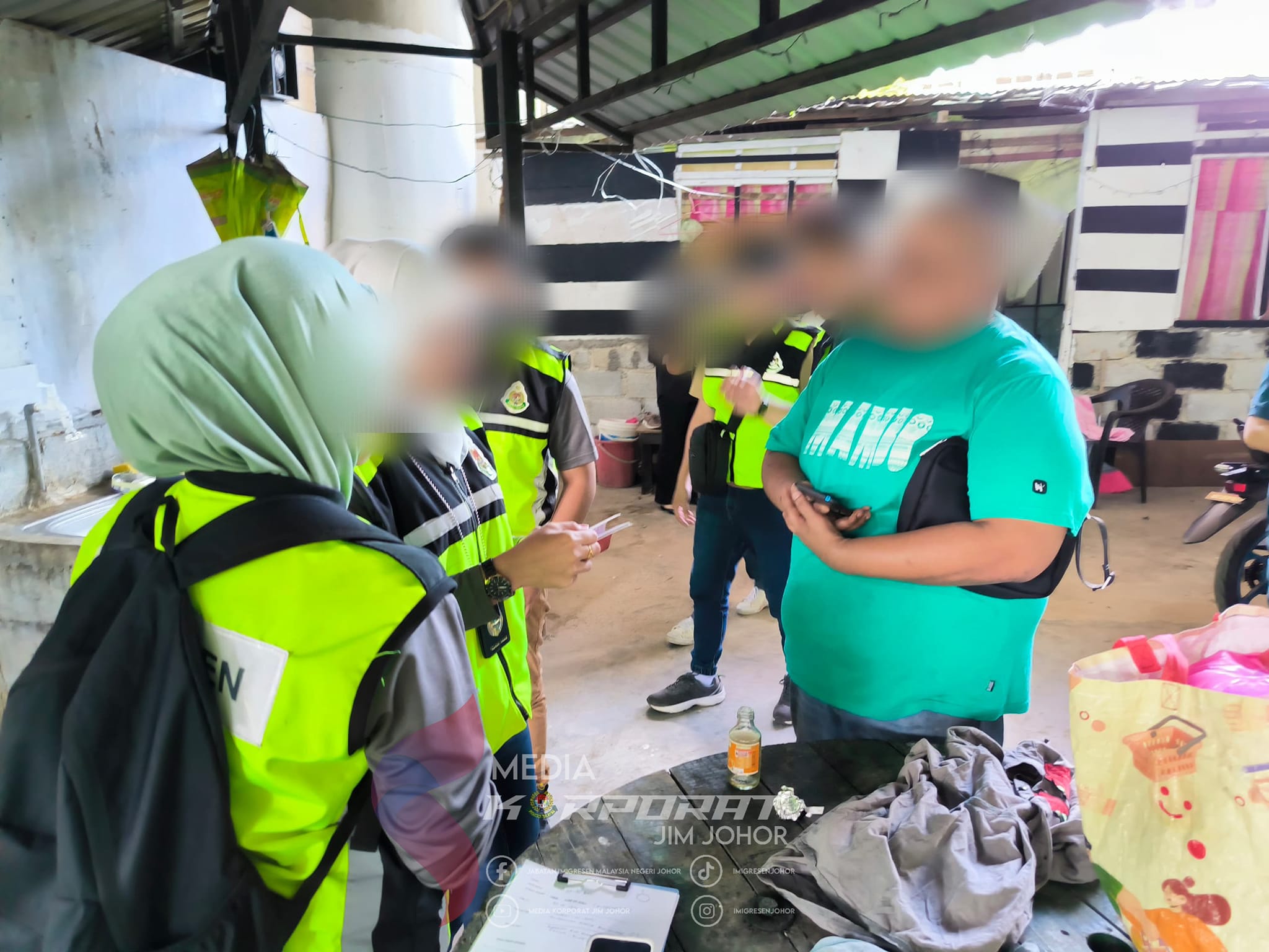Johor immigration officers conducting checks at illegal premise